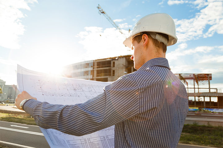 Construction superintendent monitoring a job site